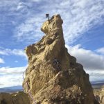 The awesome summit tower of the Cave Route (5.7) in high winds. Brogan Spire area in the Marsupial Crags.