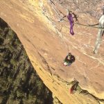 Adam learning to aid climb on the bolt ladder “Pioneer Route” on Monkey Face.