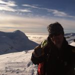 Student Evan psyched to summit Sol mountain.