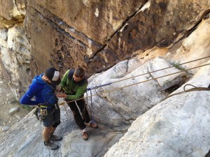 Jerome Smart building a chest harness for Craig Muderlak during self rescue practice.