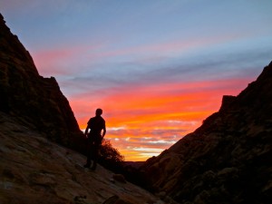 Morning glow sillouetting John Mackinnon on the way up to Rainbow Buttress in Oak Creek Canyon