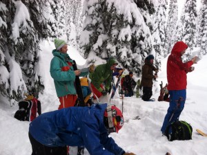 Skinning up as Jeff debriefs downhill guiding techniques.